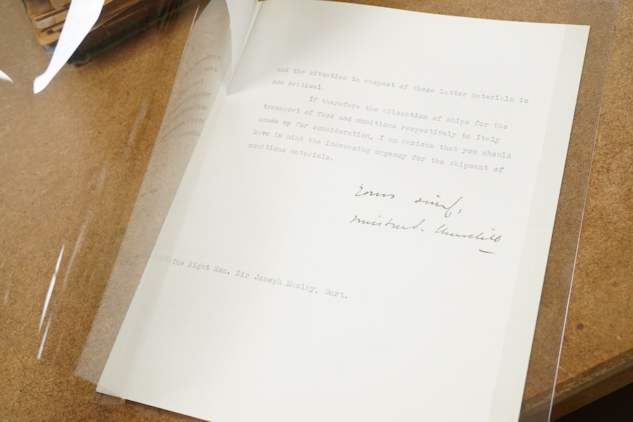 An archive of post First World War documents and photographs including two part letters signed by Winston Churchill